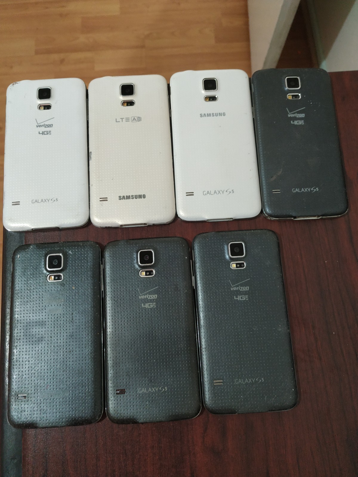 Lot of 7 Samsung Galaxy S5 SM-G900T and SM-G900V 16GB For parts